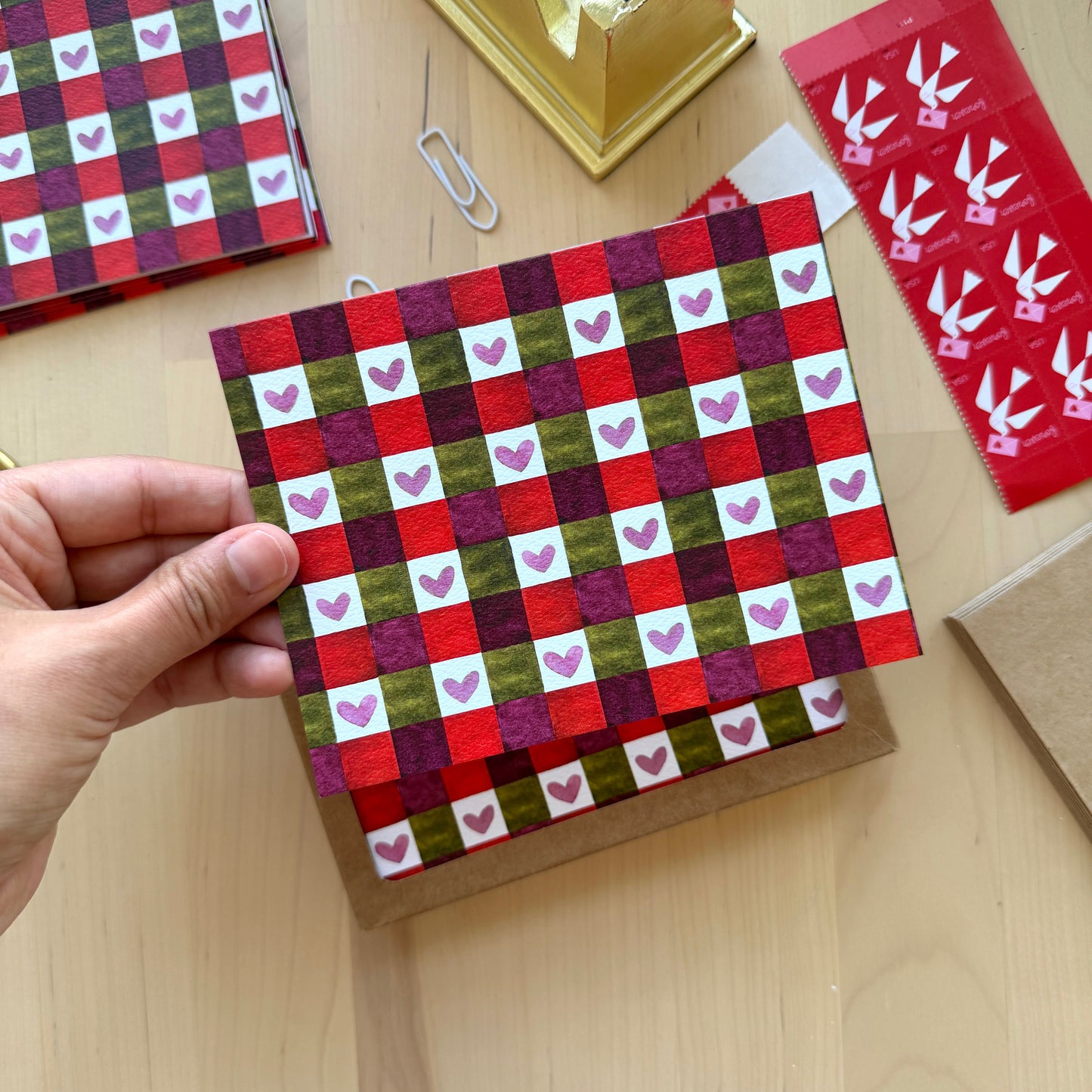 Checkered pattern birthday card on a writing desk.